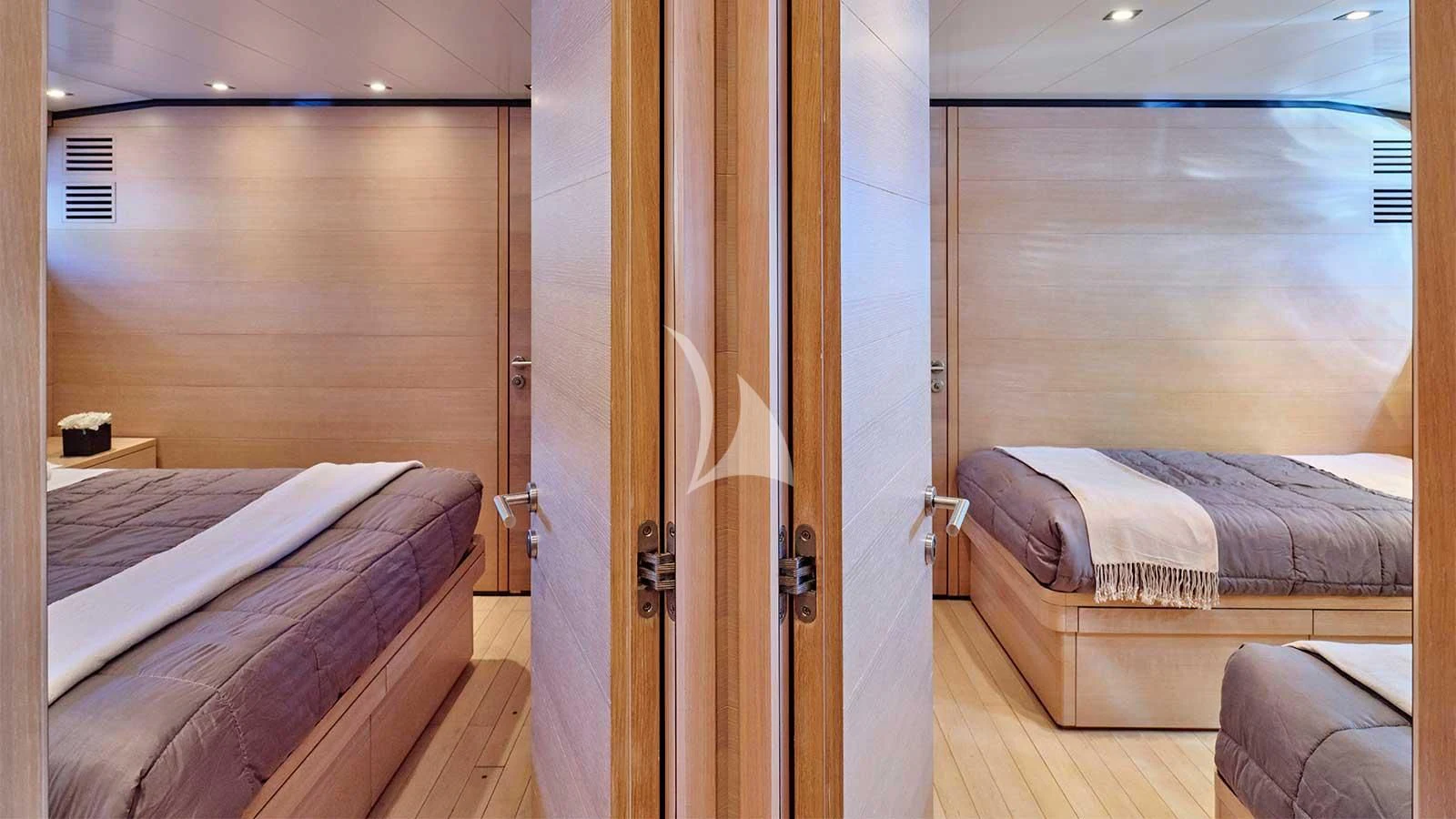 a room with two beds aboard AMICI PER SEMPRE Yacht for Charter