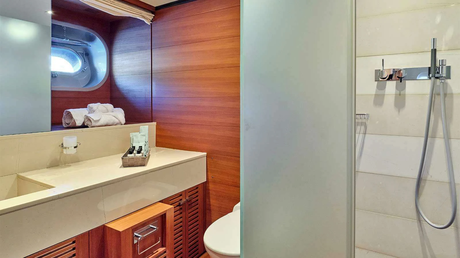 a bathroom with a shower and sink aboard AMICI PER SEMPRE Yacht for Charter