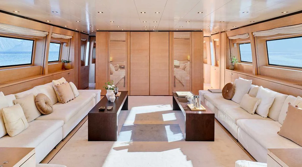 a living room with a couch and a coffee table aboard AMICI PER SEMPRE Yacht for Charter