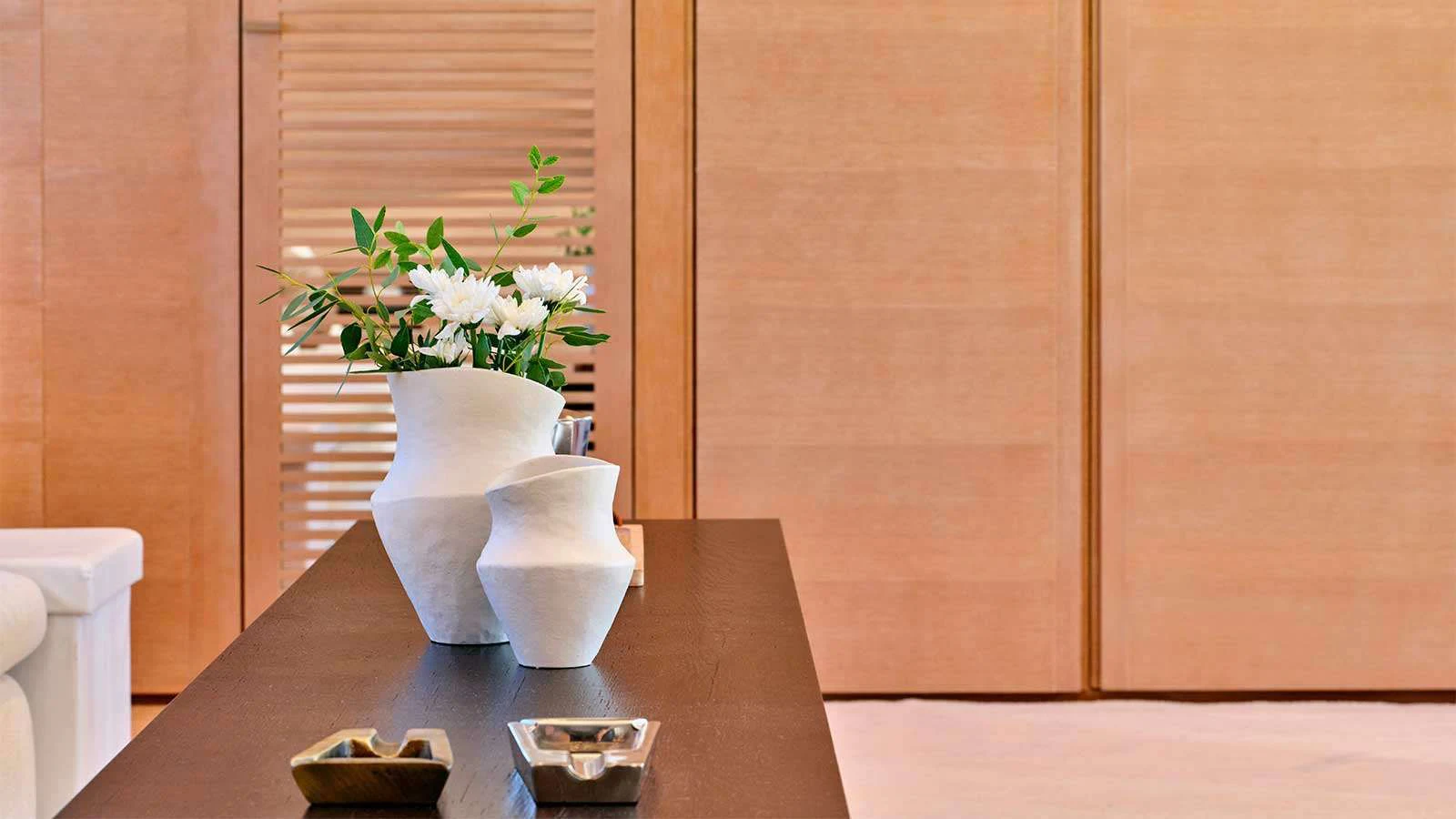 a vase with flowers on a table aboard AMICI PER SEMPRE Yacht for Charter