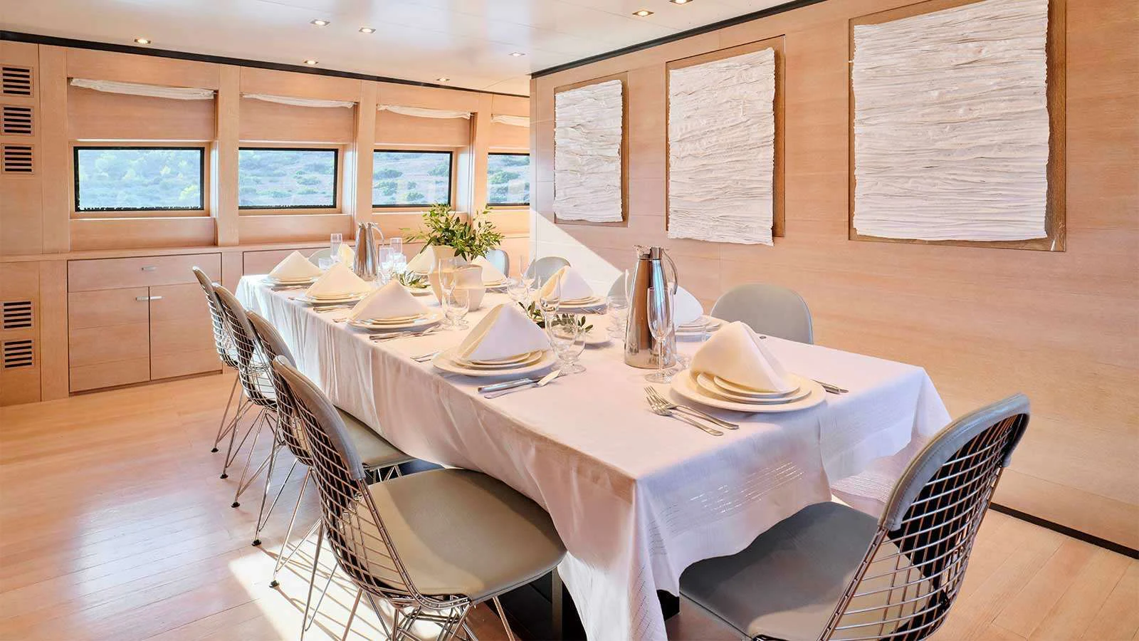 a table set for a dinner aboard AMICI PER SEMPRE Yacht for Charter