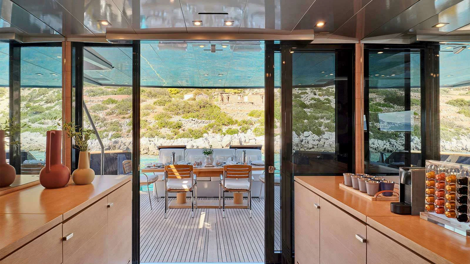 a room with a table and chairs aboard AMICI PER SEMPRE Yacht for Charter