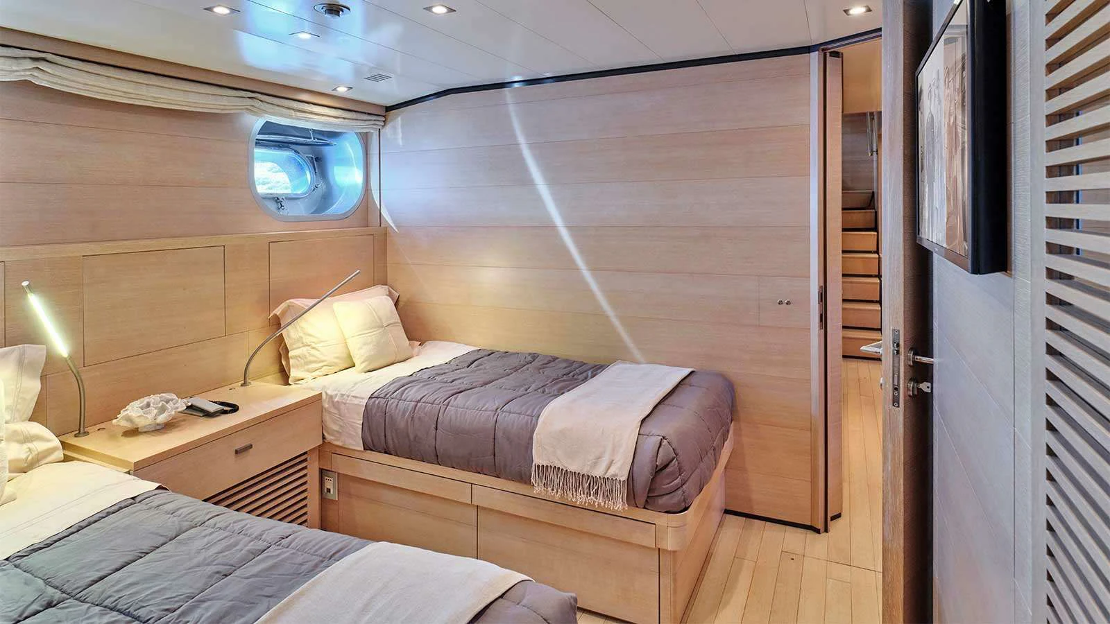a room with two beds aboard AMICI PER SEMPRE Yacht for Charter