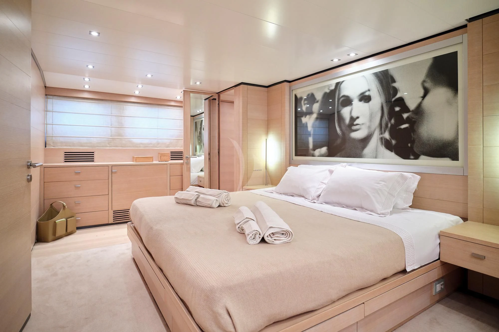 a bedroom with a large bed aboard AMICI PER SEMPRE Yacht for Charter