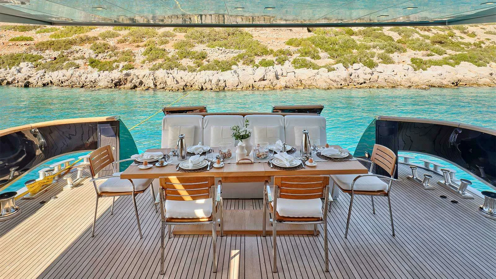 a table set for a meal on a boat aboard AMICI PER SEMPRE Yacht for Charter
