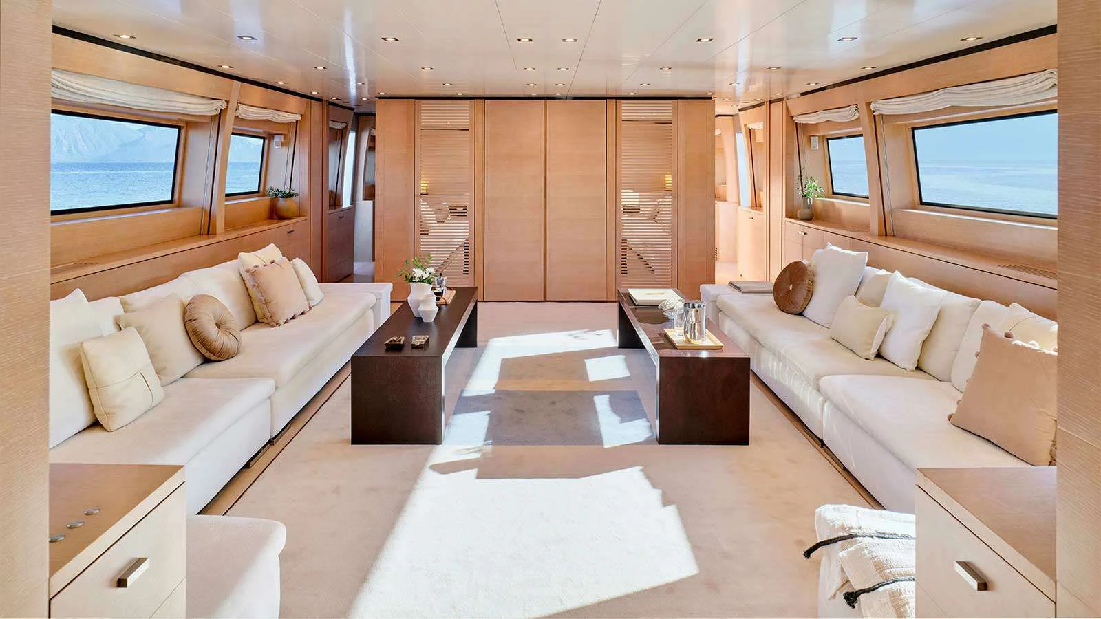a room with a couch and a table aboard AMICI PER SEMPRE Yacht for Charter