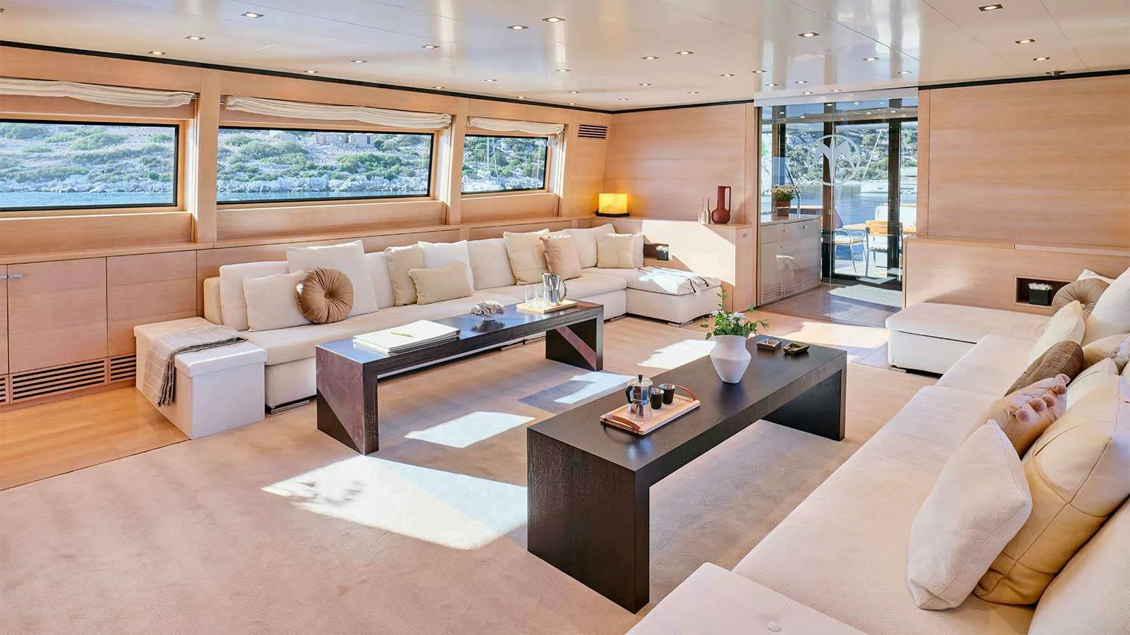 a living room with a couch and a coffee table aboard AMICI PER SEMPRE Yacht for Charter