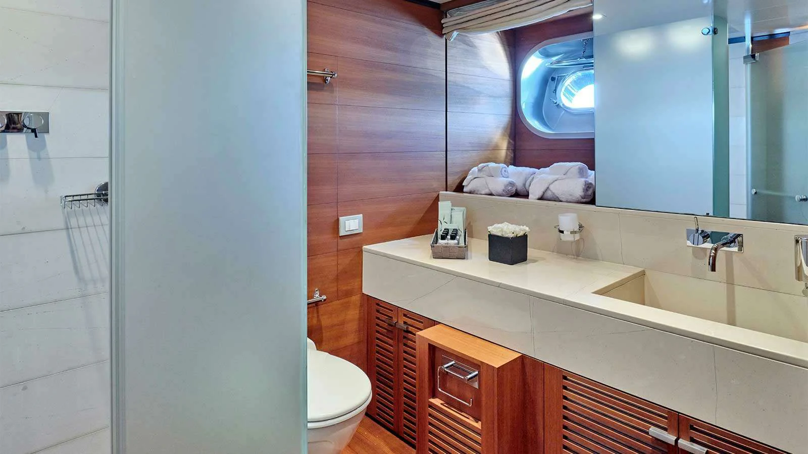 a bathroom with a sink and a mirror aboard AMICI PER SEMPRE Yacht for Charter