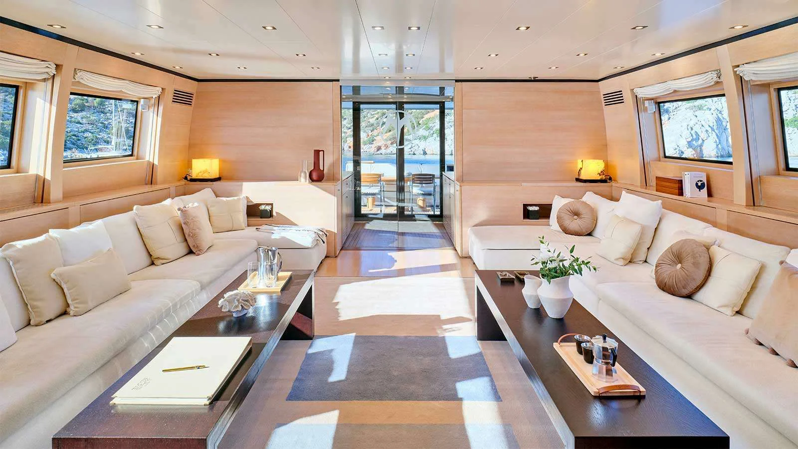 a living room with a large open door aboard AMICI PER SEMPRE Yacht for Charter