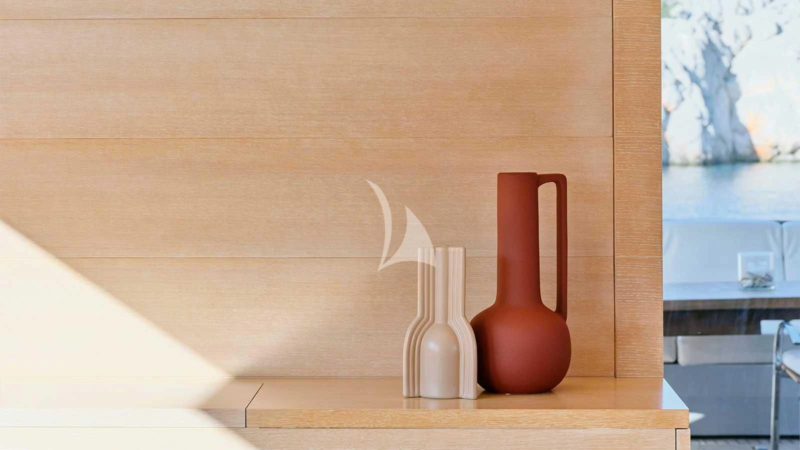 a couple of vases sit on a table aboard AMICI PER SEMPRE Yacht for Charter