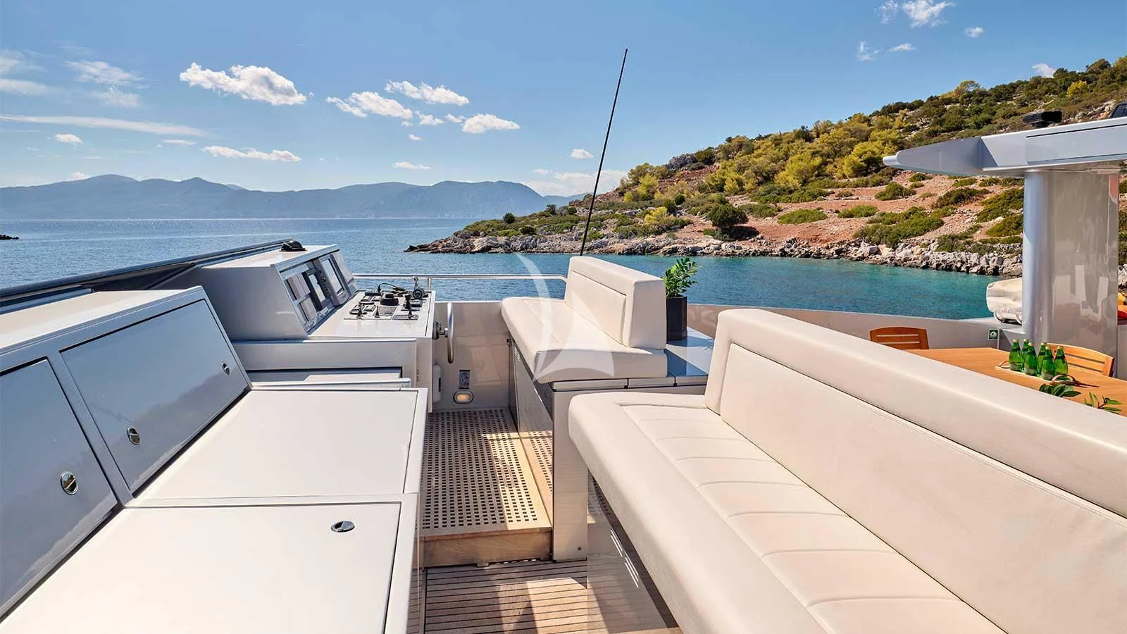 a deck with a pool and a hill in the background aboard AMICI PER SEMPRE Yacht for Charter