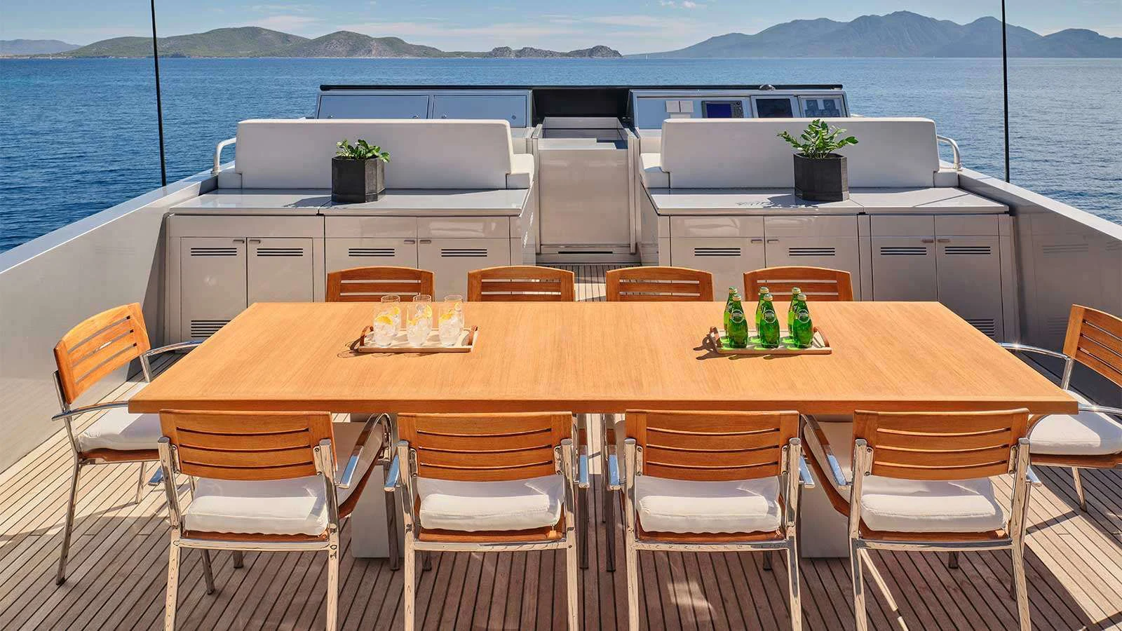 a table with chairs and a table aboard AMICI PER SEMPRE Yacht for Charter