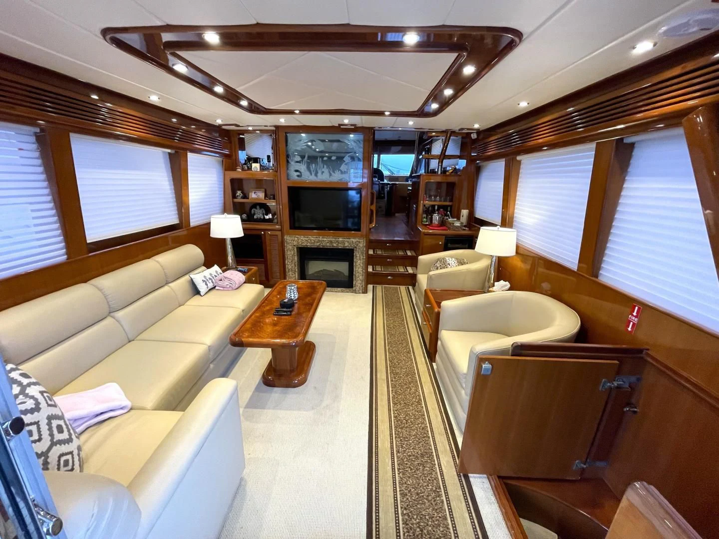 a living room with a large mirror aboard MIA AND MAUI JIM Yacht for Sale