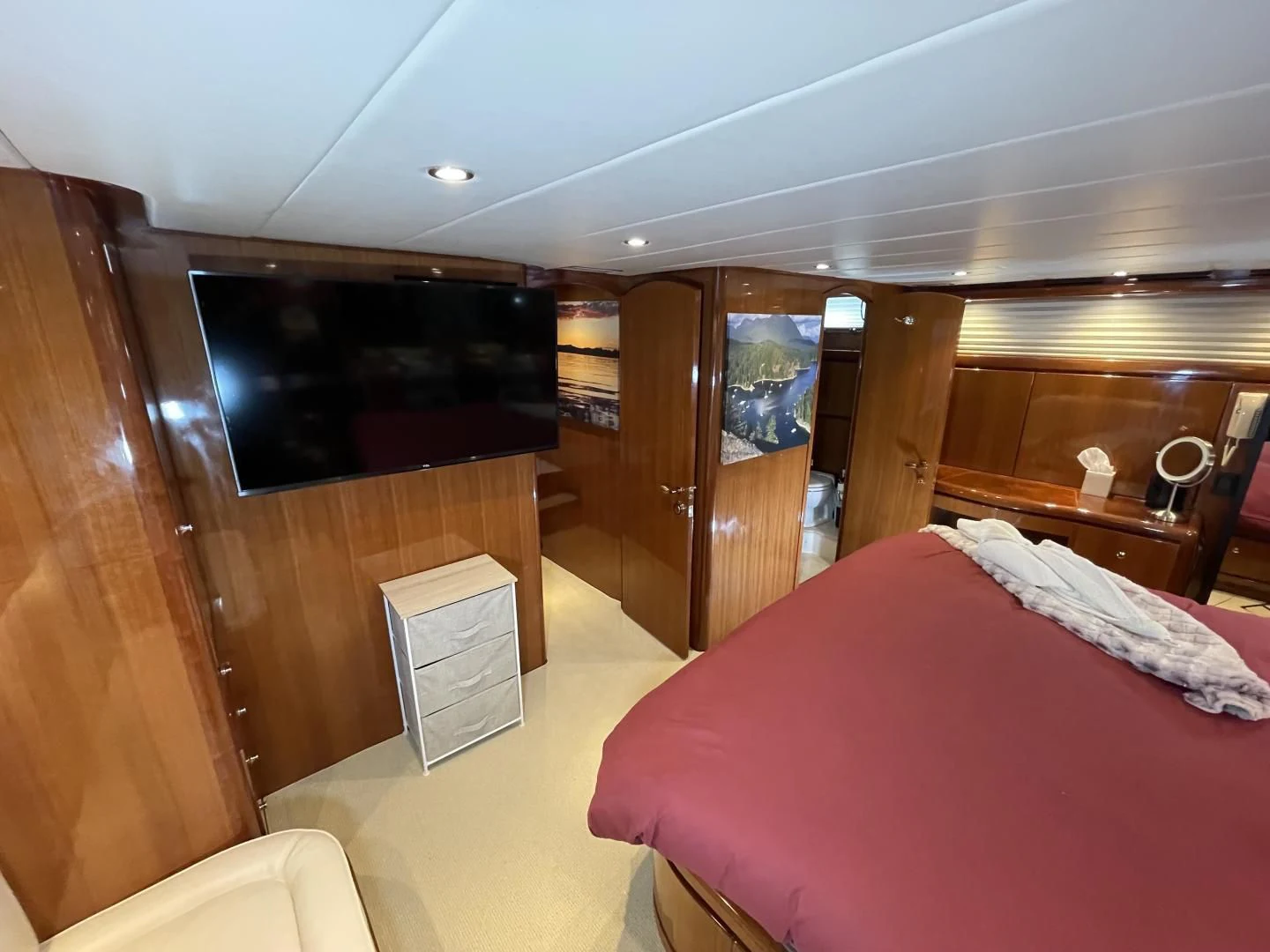 a room with a bed and a television aboard MIA AND MAUI JIM Yacht for Sale