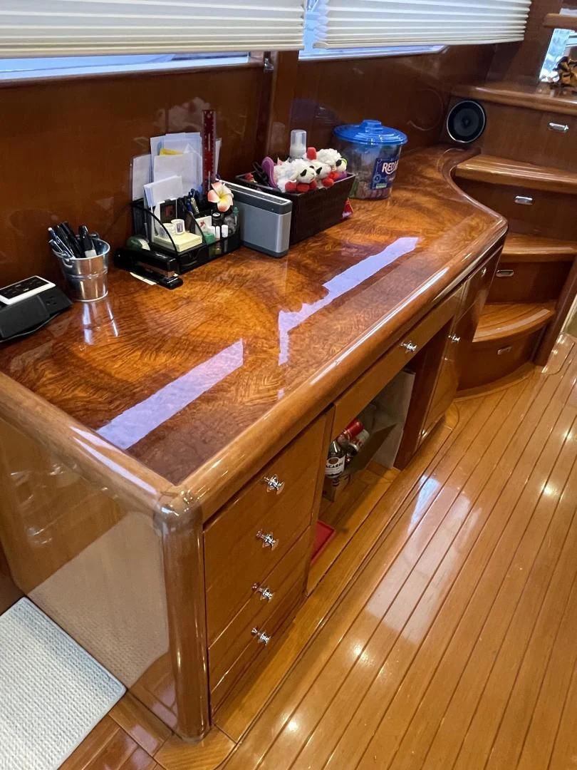 a wooden table with a few objects on it aboard MIA AND MAUI JIM Yacht for Sale
