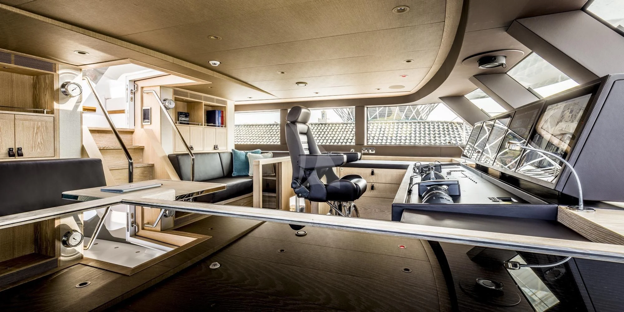 a room with a desk and chairs aboard CALYPSO I Yacht for Charter