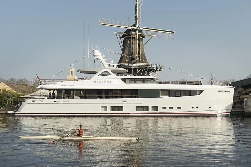 a large white boat with a crane on top aboard CALYPSO I Yacht for Charter