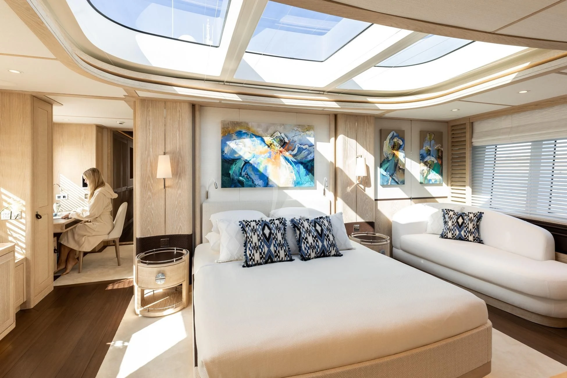 a room with a bed and a couch aboard CALYPSO I Yacht for Charter