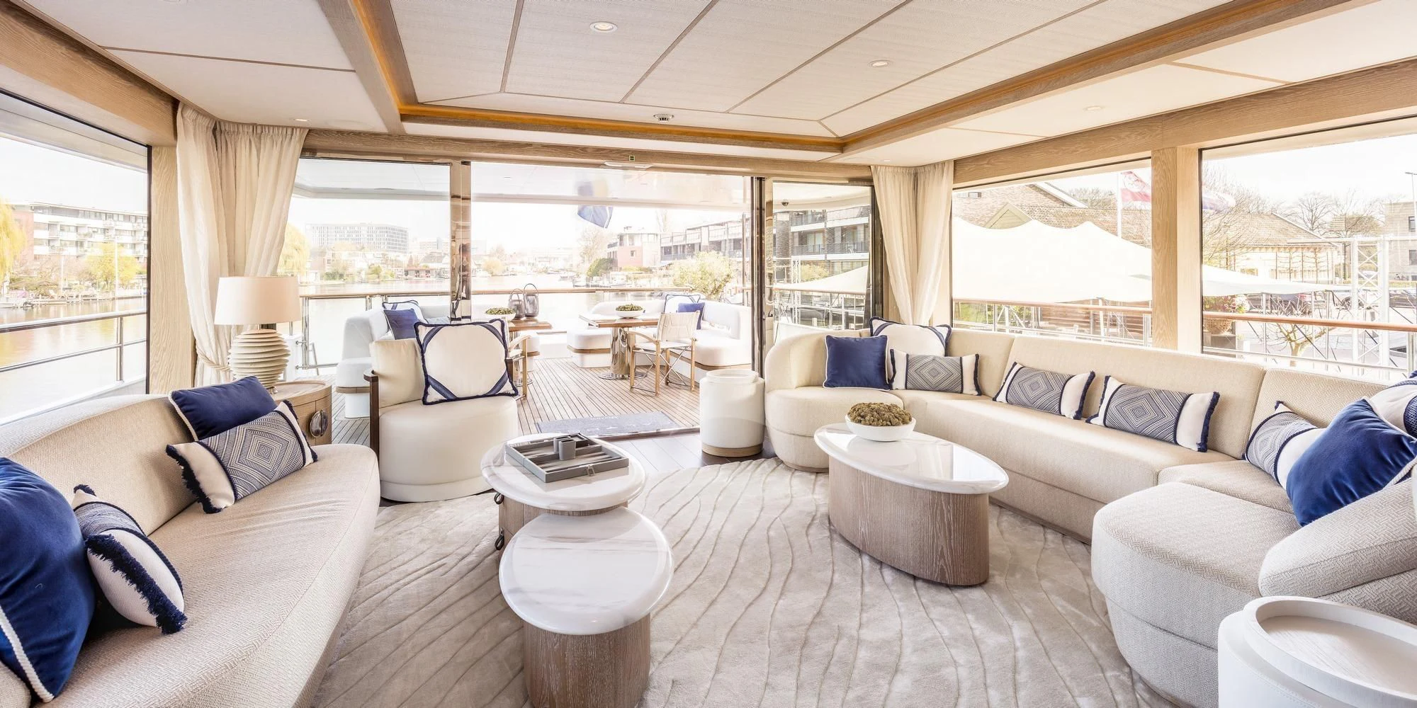 a living room with a large window aboard CALYPSO I Yacht for Charter