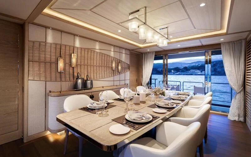 a dining table in a room aboard CALYPSO I Yacht for Charter
