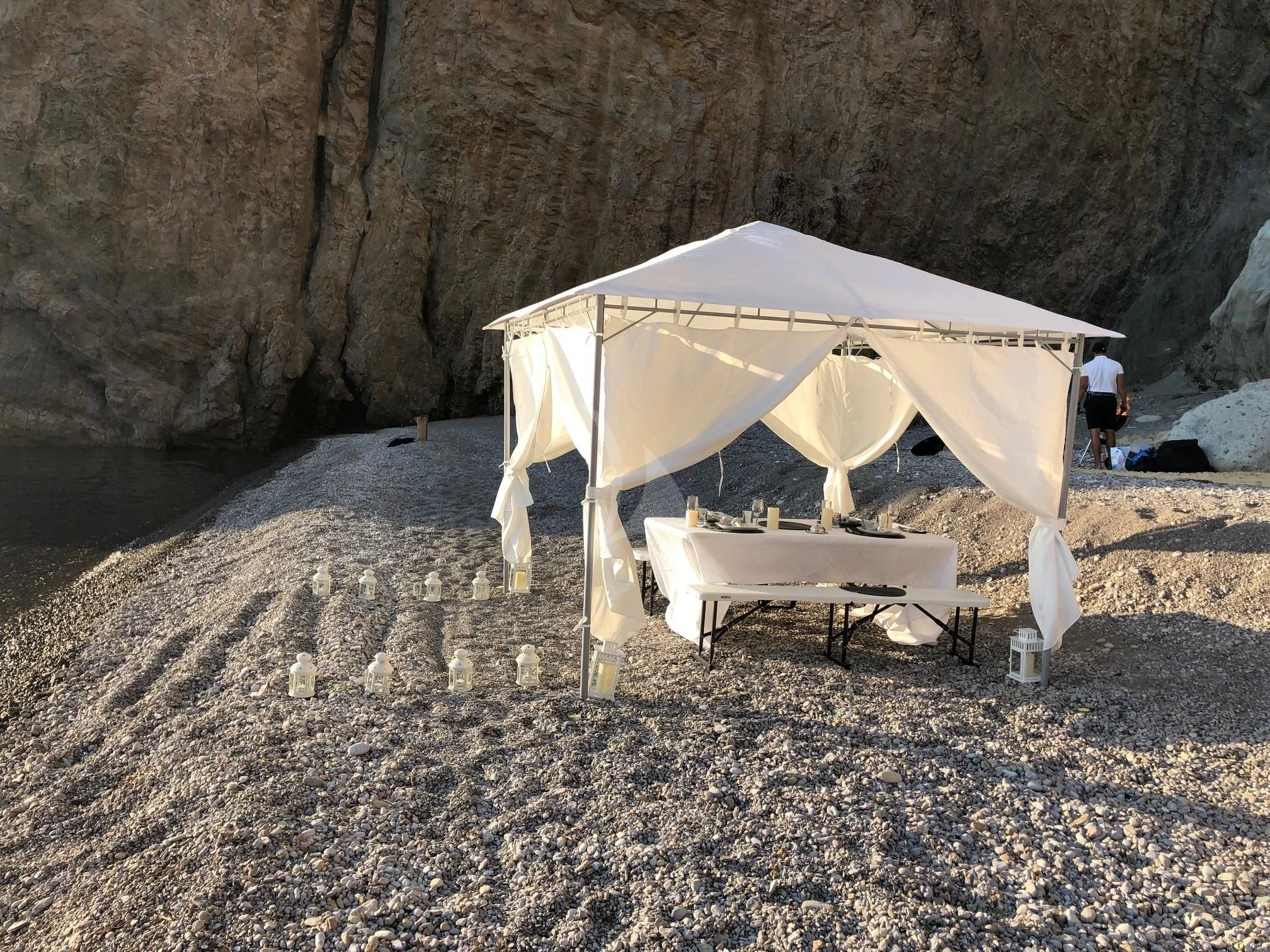 a couple of white tents on a rocky hill aboard CALYPSO I Yacht for Charter