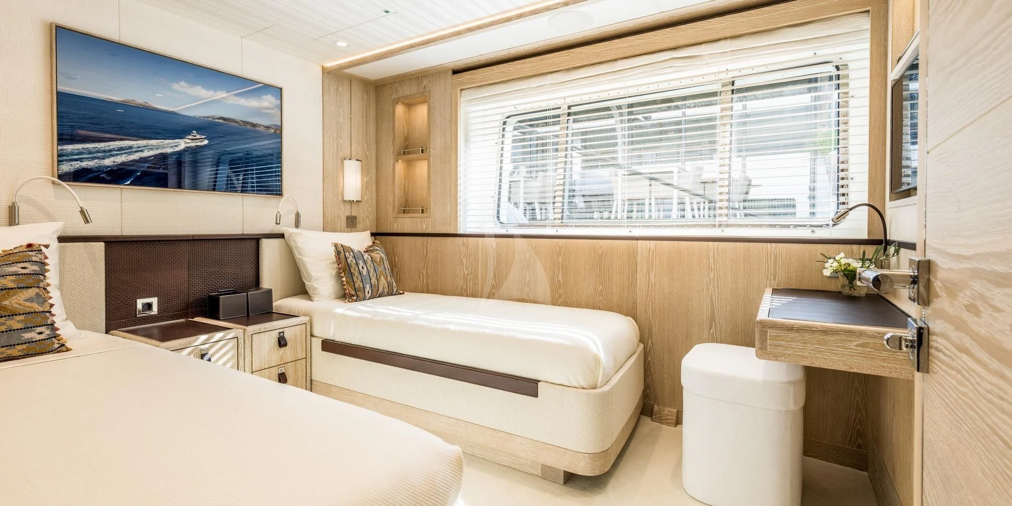 a room with a bed and a sink aboard CALYPSO I Yacht for Charter
