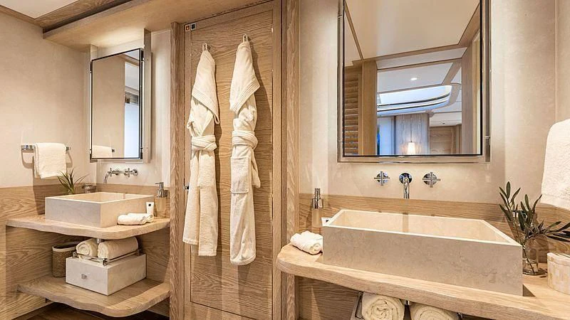 a bathroom with a large mirror aboard CALYPSO I Yacht for Charter
