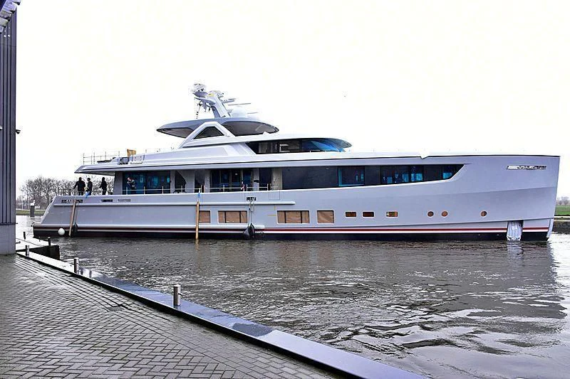 a large white boat on a body of water aboard CALYPSO I Yacht for Charter