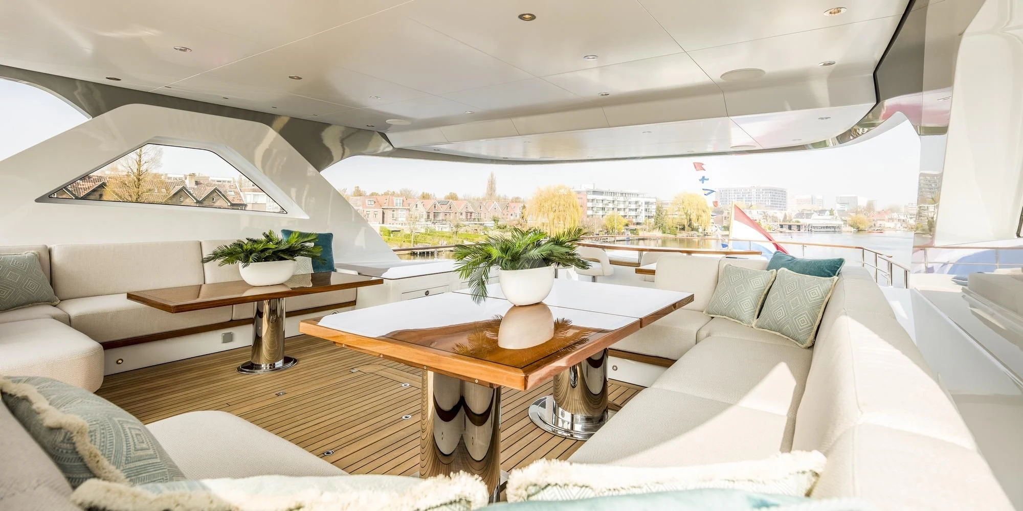 a room with a table and couches aboard CALYPSO I Yacht for Charter