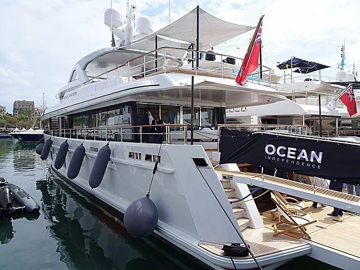 a boat with a flag on the front aboard CALYPSO I Yacht for Charter