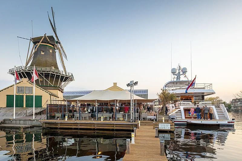 a dock with boats and people aboard CALYPSO I Yacht for Charter
