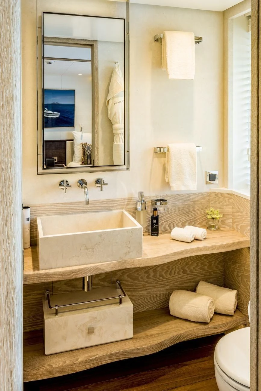 a bathroom with a large mirror aboard CALYPSO I Yacht for Charter