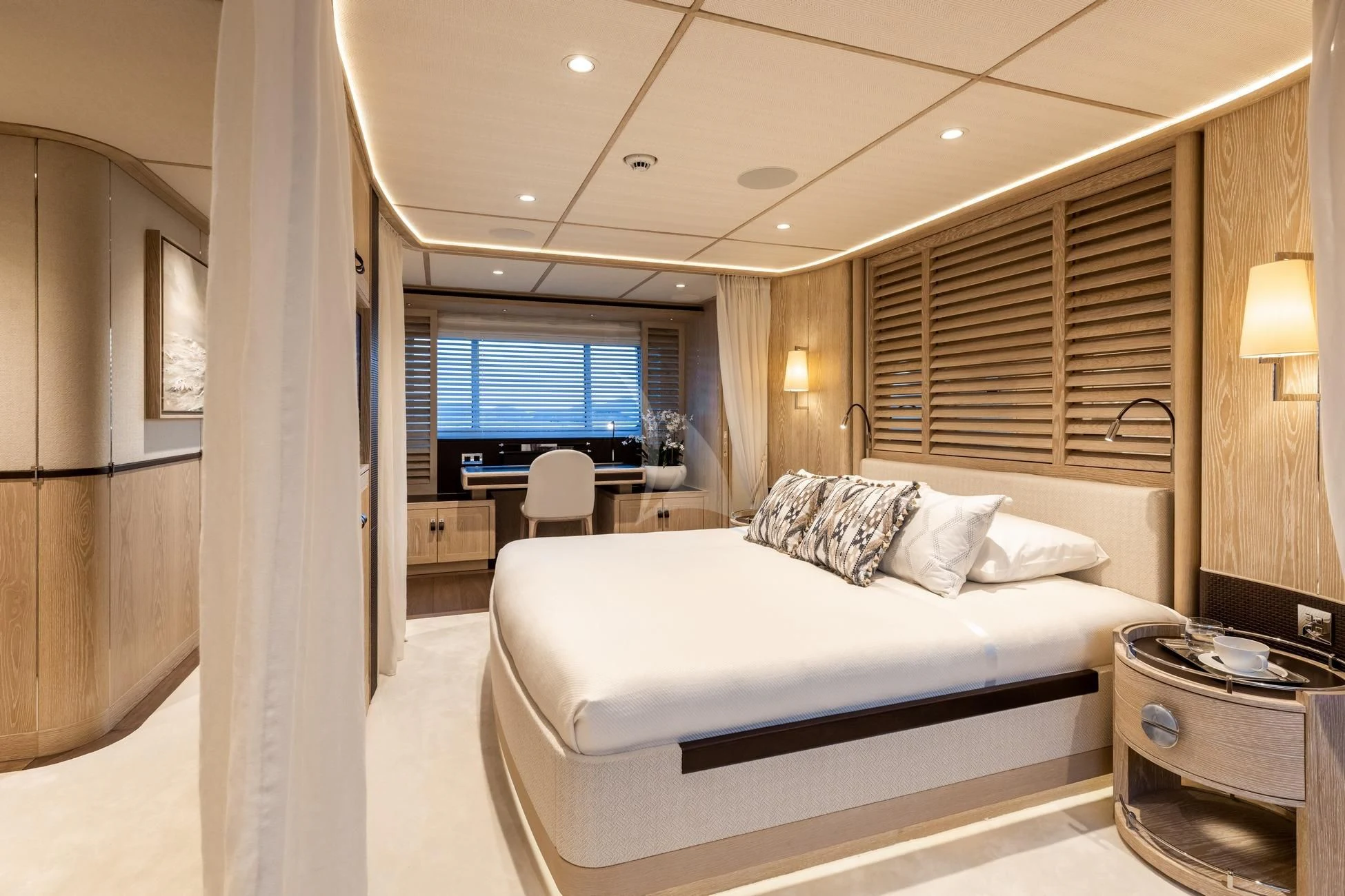 a room with a bed and a television aboard CALYPSO I Yacht for Charter