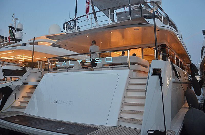 a boat with a person standing on the deck aboard CALYPSO I Yacht for Charter