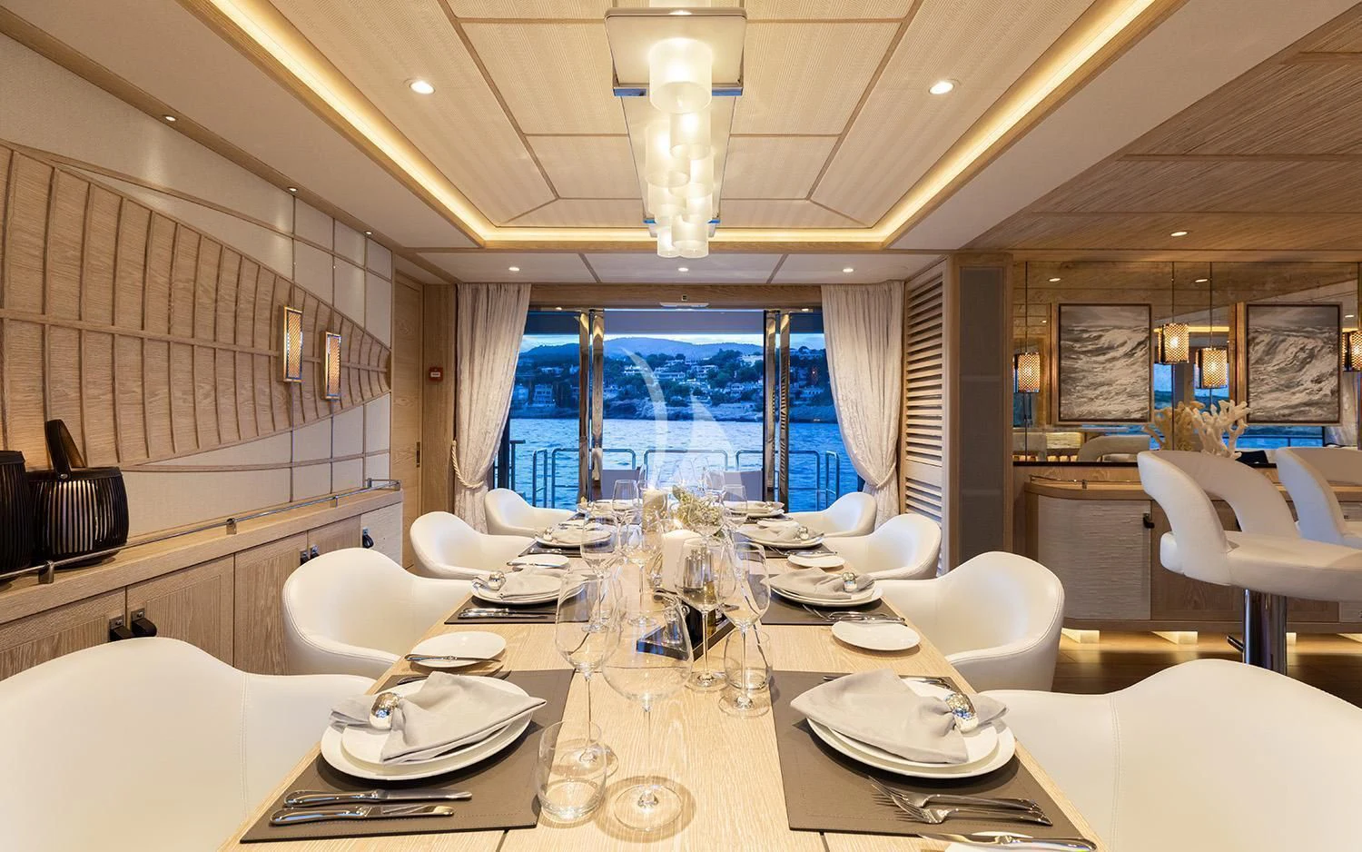 a large room with tables and chairs aboard CALYPSO I Yacht for Charter