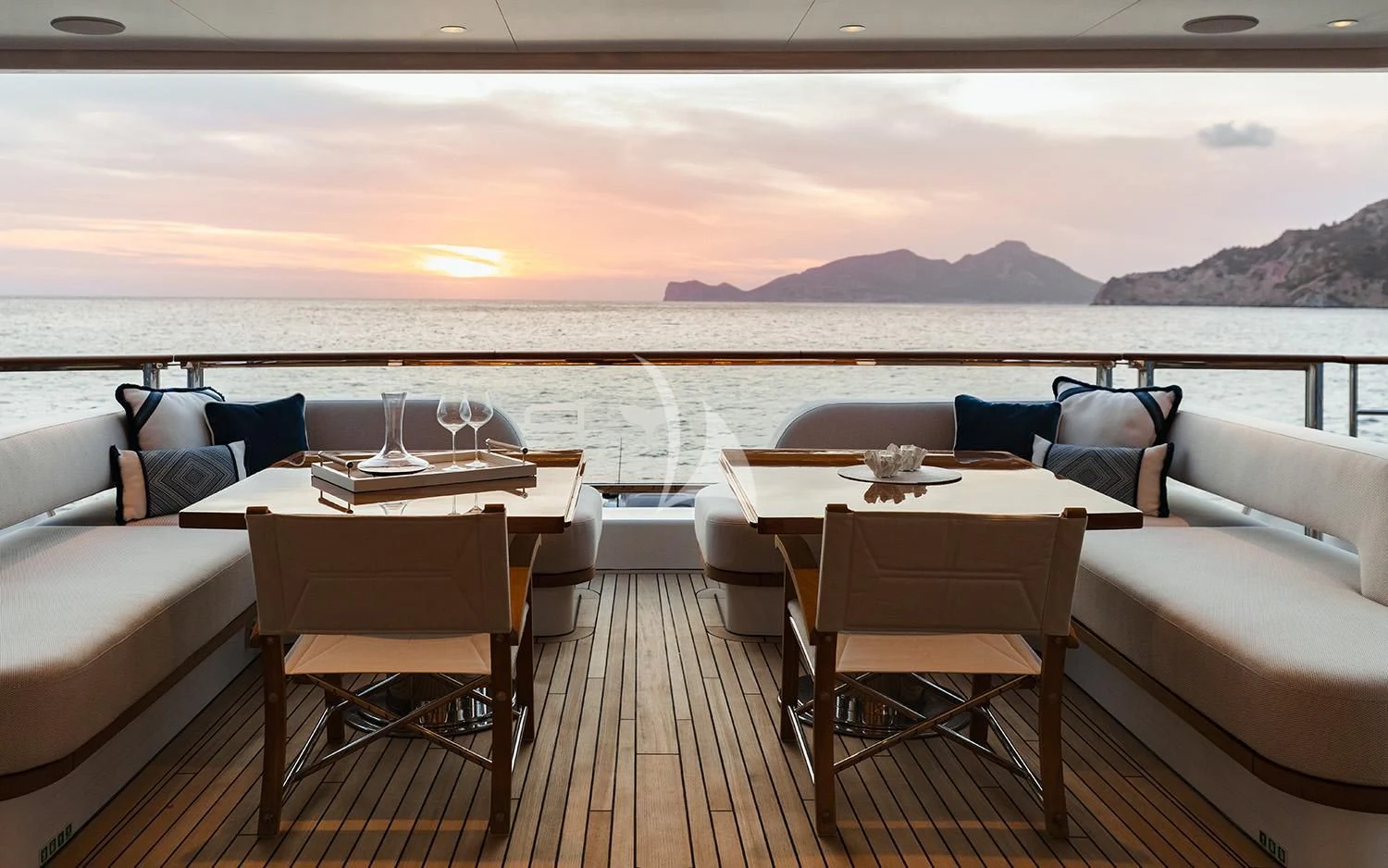 a room with a couch and a table and chairs aboard CALYPSO I Yacht for Charter
