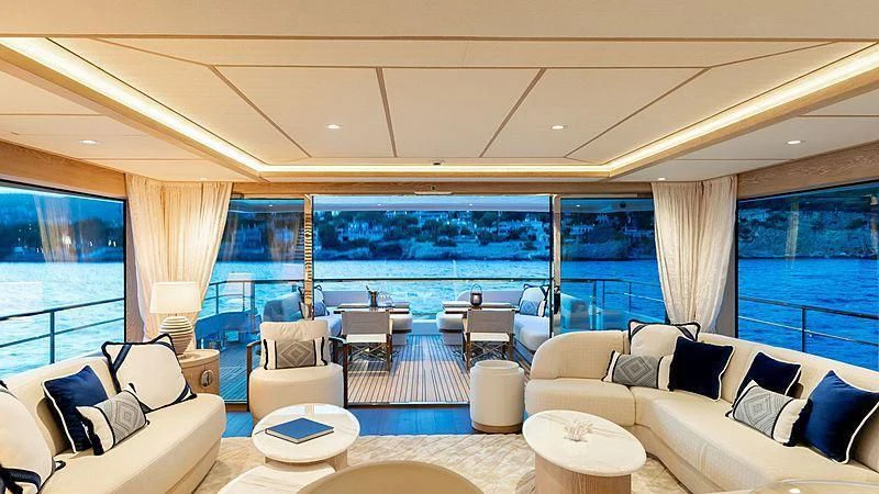 a living room with a large window aboard CALYPSO I Yacht for Charter