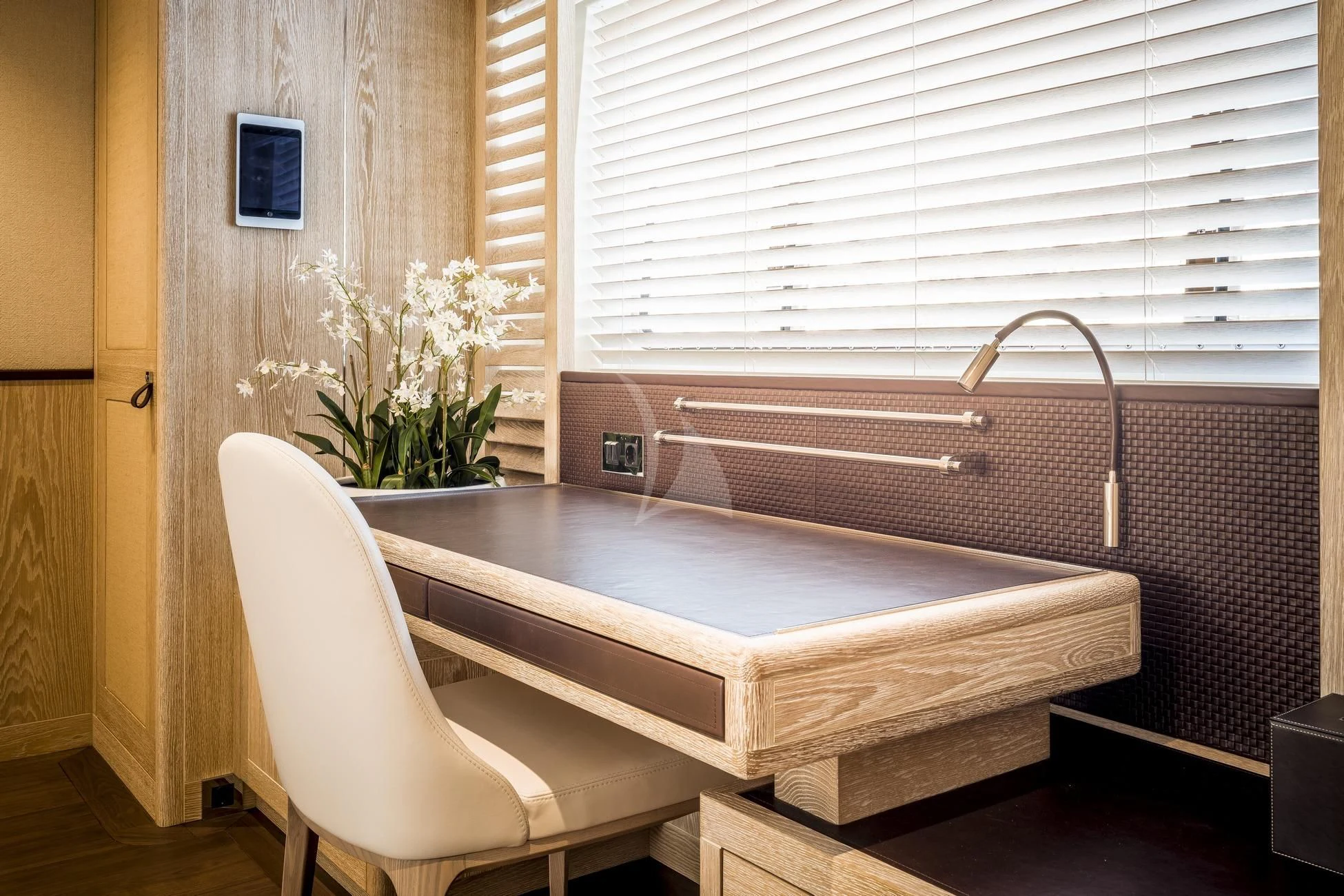 a white chair next to a table aboard CALYPSO I Yacht for Charter