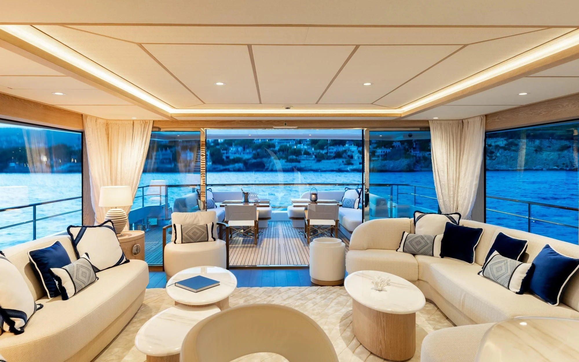 a living room with a large window aboard CALYPSO I Yacht for Charter
