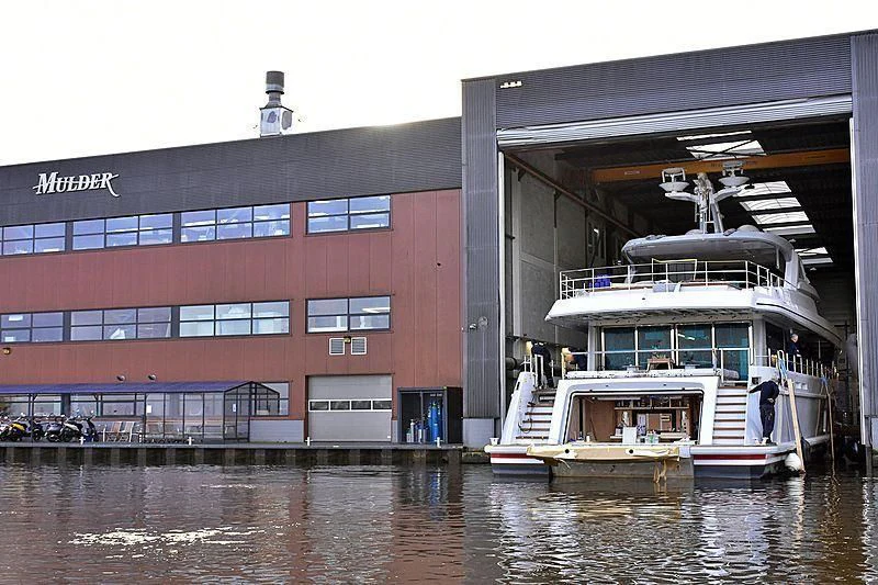 a boat docked in front of a building aboard CALYPSO I Yacht for Charter