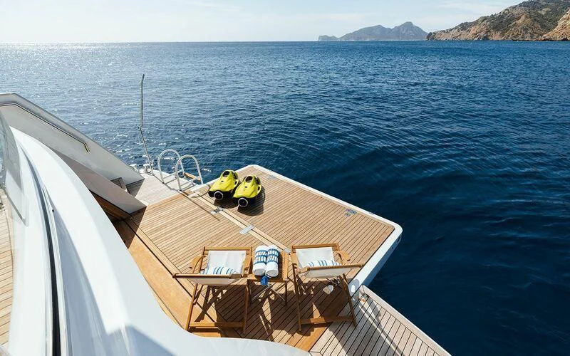 a person in a life jacket on a boat in the water aboard CALYPSO I Yacht for Charter
