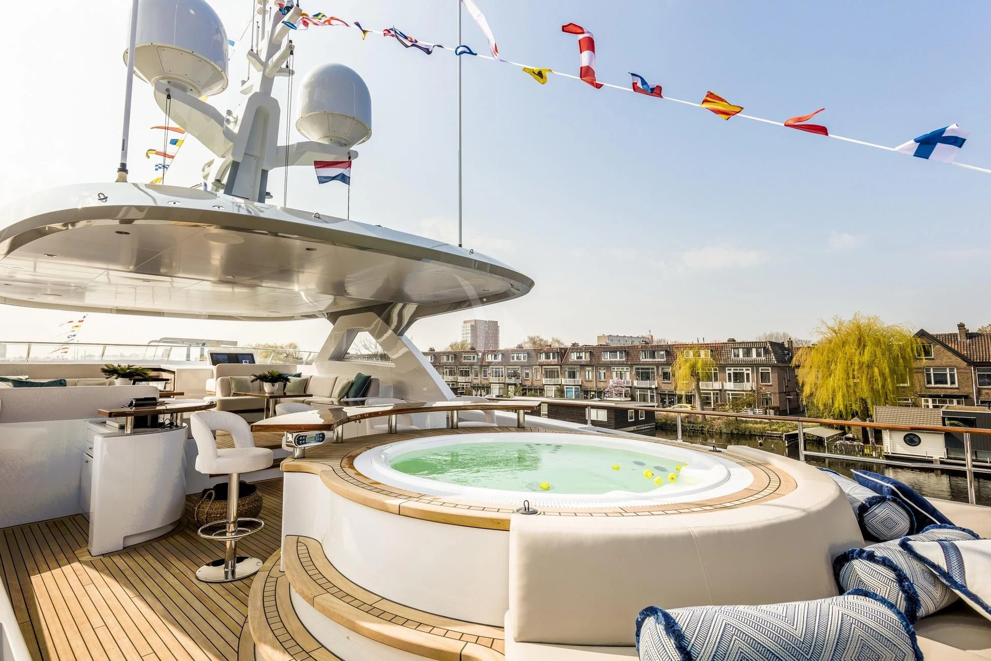 a large white pool with a large white dome and a white dome with red flags and a blue aboard CALYPSO I Yacht for Charter