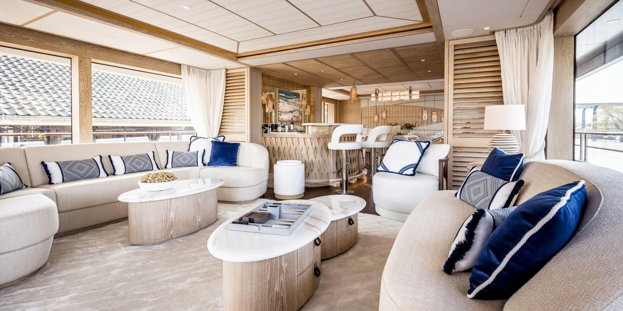 a living room with a couch and a table aboard CALYPSO I Yacht for Charter