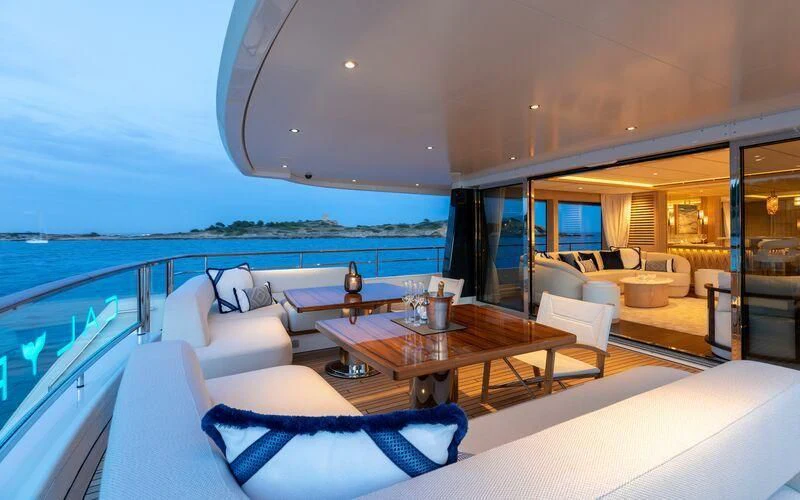 a living room with a large balcony aboard CALYPSO I Yacht for Charter