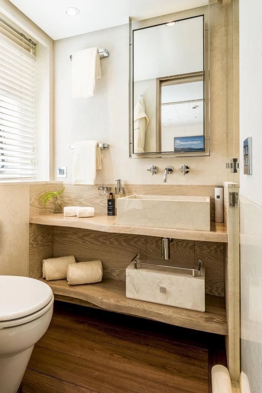 a bathroom with a sink and a mirror aboard CALYPSO I Yacht for Charter