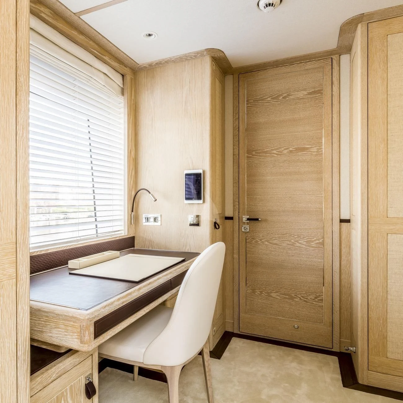 a room with a table and a chair aboard CALYPSO I Yacht for Charter