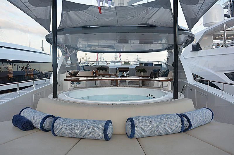 a person lying on a bed aboard CALYPSO I Yacht for Charter
