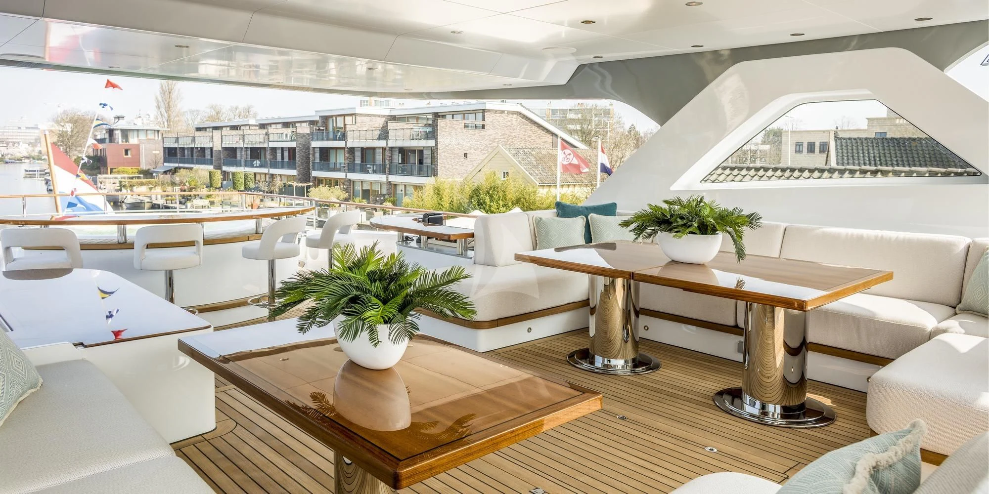 a room with tables and chairs aboard CALYPSO I Yacht for Charter
