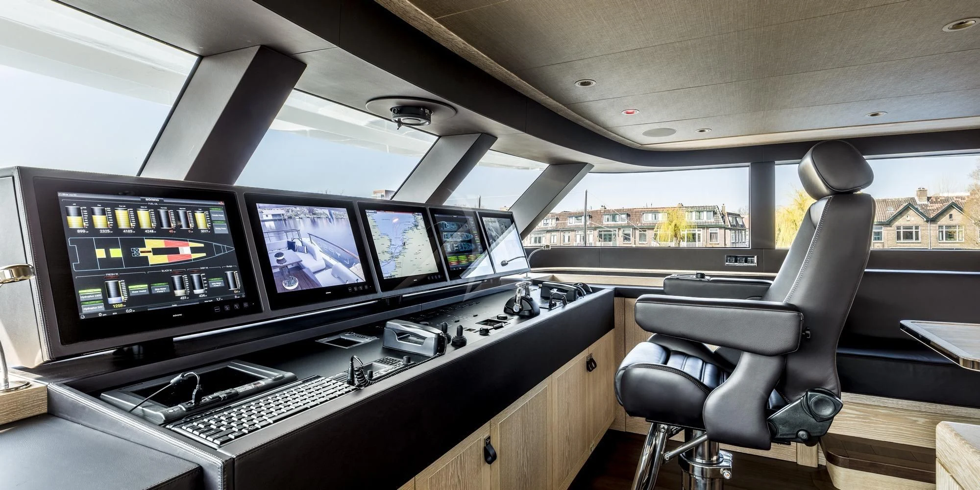 a room with many monitors and keyboards aboard CALYPSO I Yacht for Charter
