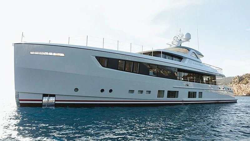 a large white boat in the water aboard CALYPSO I Yacht for Charter